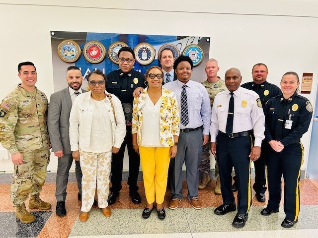 Fort Detrick Police Capt. Reggie Mose is joined by family, colleagues, and Fort Detrick’s garrison leadership team after being awarded a Department of Defense Police Leadership Award