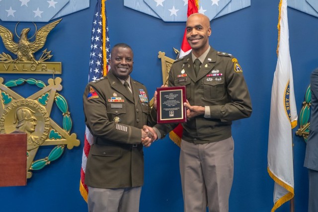 WASHINGTON, D.C. - Lt. Gen. David Wilson, Deputy Chief of Staff, G-9, Headquarters Department of the Army, presents the 2024 Army Community Partnership Award to Lt. Col. Craig A. Bonham II, Picatinny Arsenal Garrison Commander, during a ceremony...