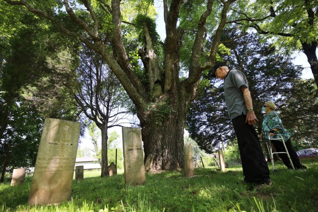 Family members visit a loved one during Memorial Day visitation at Fort Knox, Kentucky.