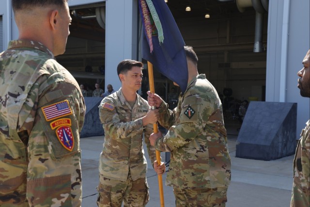 Capt. Kyle D. Osborne (center) and 1st Sgt. Joel M. Jimenez (right)