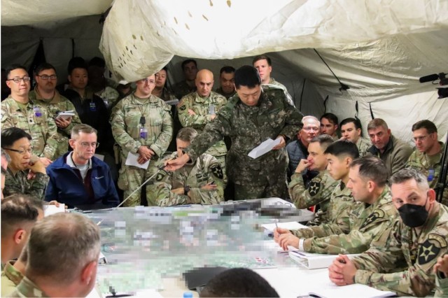 MAJ Kim briefs 2ID/RUCD Leadership during the 2ID/RUCD targeting meeting during the division WFX