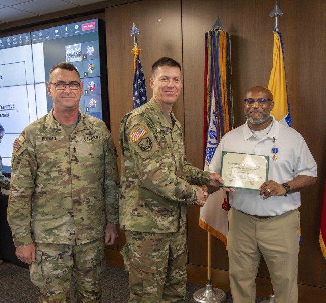 U.S. Army Security Assistance Command&#39;s Brig. Gen. Allen Pepper and Command Sgt. Maj. Stephen recognized outstanding employees, including Chinwan Barnett, the FY24 USASAC Employee of the Year.