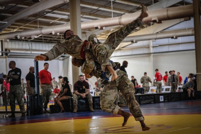 Capt. Martayez White, assigned to 1st Battalion, 319th Field Artillery Regiment, 82nd Airborne Division, takes down Cpl.  Juan Cervantes Jimenez, assigned to Bravo Company, 3rd Battalion, Brigade Support Battalion, 82nd Airborne Division, in the...