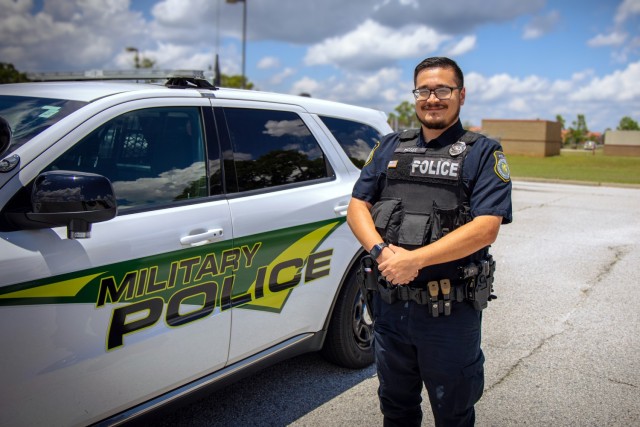Officer Ian McGee, a Department of the Army police officer at Fort Eisenhower, takes a moment beside his patrol vehicle at the Fort Eisenhower Law Enforcement Center. A former Soldier and 31 Bravo (military police) in the Army, McGee continues to...