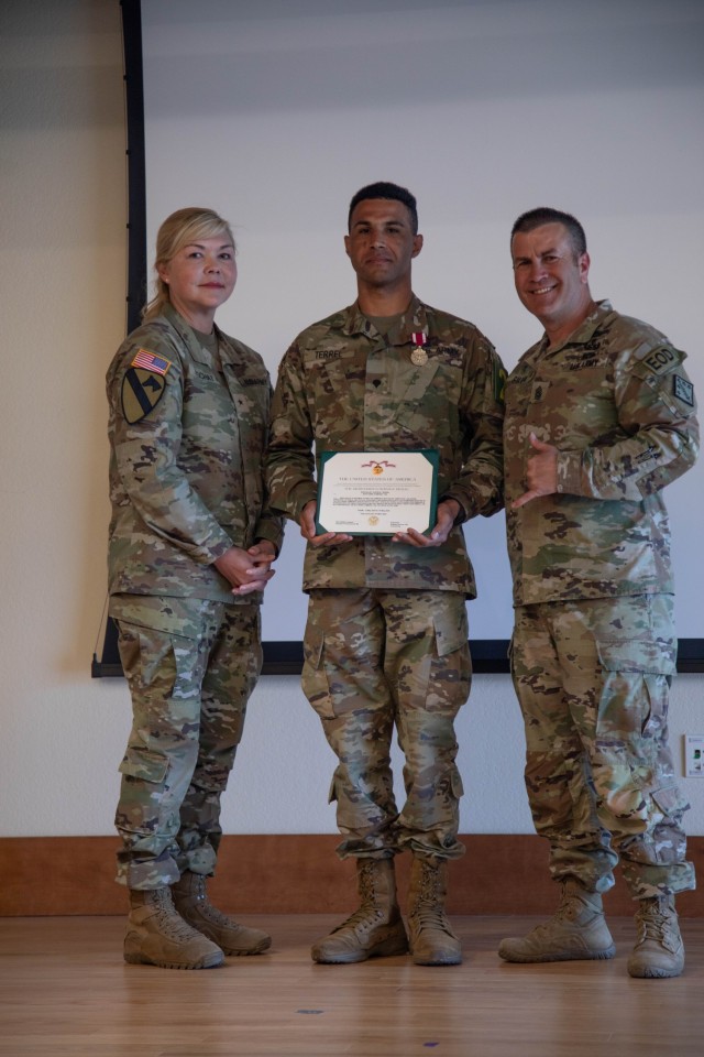 Brig. Gen. W Bochat (left), Spc. Justin Terrel (center) and Command Sgt. Maj. Dave Silva (right)