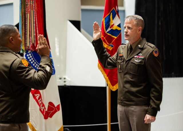 U.S. Army Col. Glenn A. Henke, commandant of the U.S. Army Air Defense Artillery School and deputy commanding officer of the U.S. Army Fires Center of Excellence and Fort Sill, recites the oath of office during his frocking ceremony at the Air...