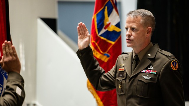 U.S. Army Col. Glenn A. Henke, commandant of the U.S. Army Air Defense Artillery School and deputy commanding officer of the U.S. Army Fires Center of Excellence and Fort Sill, recites the oath of office during his frocking ceremony at the Air...