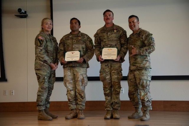 Brig. Gen. W Bochat (left), Sgt. Danuel Arocha (second from left), Sgt. Mckenzie Meyer (second from right) and Command Sgt. Maj. Dave Silva (right)