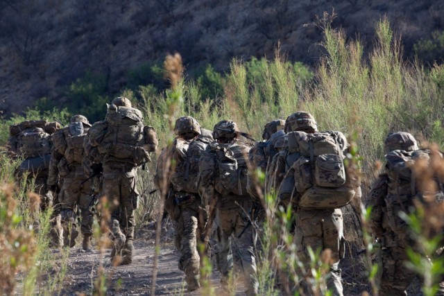 U.S. Soldiers from Charlie Company, 1st Battalion, 41st Infantry Regiment, assigned to Joint Task Force–Southern Border, move to a patrol base near Tucson, Ariz., May 11, 2025.