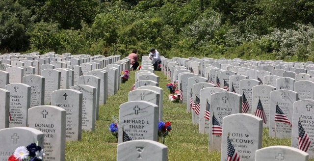 Community members visit with loved ones during the annual Fort Knox Memorial Day Ceremony at Kentucky Veterans Cemetery Central in Radcliff, Kentucky, May 26, 2025.