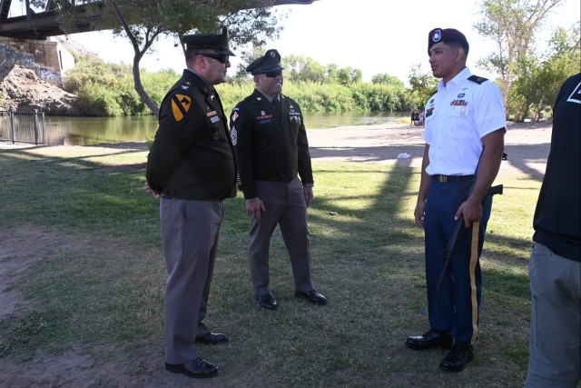 U.S. Army Yuma Proving Ground (YPG) Commander Col. John Nelson (left) and Command Sgt. Maj. Mark Millare (center) talk with Army Test and Evaluation Command Soldier of the Year Staff Sgt. Angel Viveros at a Memorial Day observance at Yuma&#39;s...