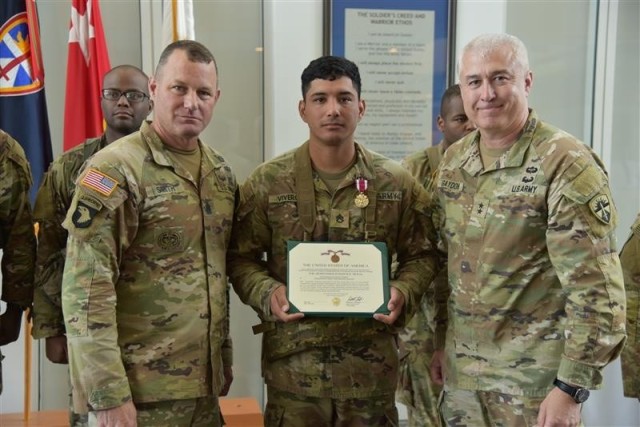 Airborne Test Force Soldier Staff Sgt. Angel Viveros (center) earned the title of the U.S. Army Test and Evaluation (ATEC) Noncommissioned Officer of The Year on April 30, after a grueling three-day competition. He’s pictured with ATEC Commander...