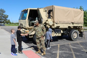 Students receive an Army experience during a local “Touch a truck” event