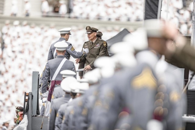 Graduates of the U.S. Military Academy walk across the stage at the commencement ceremony, West Point, N.Y., May 24, 2025.