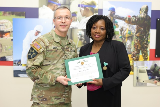 Col. Scott J. Smith (left) and Angela D. Howze (right)