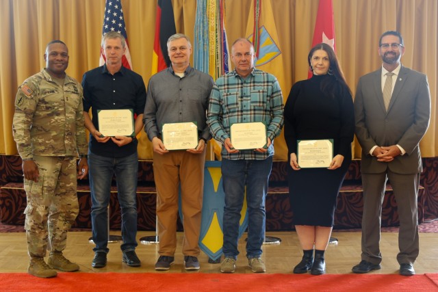 Maj. Gen. Ronald R. Ragin, commanding general 21st Theater Sustainment Command, Michael S. Amarosa, civilian deputy to the commanding general, and civilian employees pose for a photo after being recognized for being the employees of the first,...