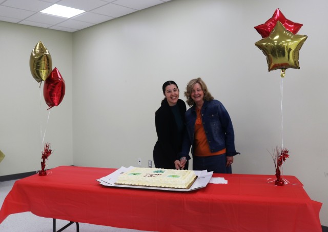 (From left) Kirk U.S. Army Health Clinic nurses 1st Lt. Megan Vera and Heidi Jackson participate in a ceremonial cake cutting during an event to celebrate National Nurses Week at the KUSAHC Ortiz Training Center May 16, 2025.
