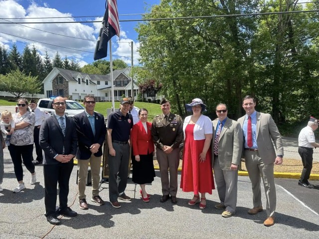 RANDOLPH, N.J. - Maj. AJ Scocco of Picatinny Arsenal gathers with officials after speaking at a Memorial Day observance, May 26.