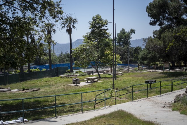 Farnsworth Park sits quiet and fenced off in Altadena, California, as crews continue wildfire debris removal May 23, 2025. The park remains closed to the public for safety as cleanup progresses, with