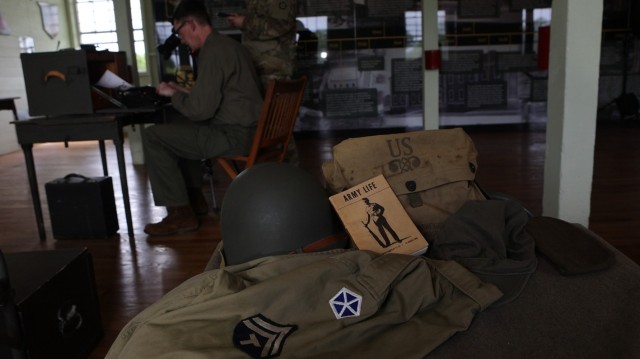 General George Patton Museum of Leadership director Ty Reid acts out common WWII barracks life at Fort Knox, Kentucky, May 14, 2025.