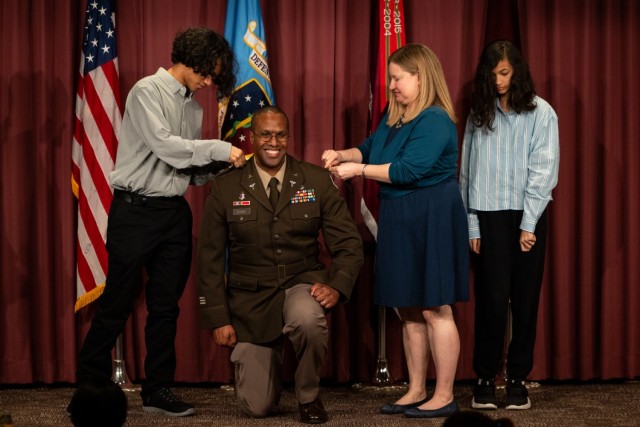 1Brig. Gen. Clinton K. Murray (left) Commanding General, United States Army Medical Center of Excellence (MEDCoE) and Chief of the U.S Army Medical Corps presided over the Promotion ceremony of BHSL Director Col. Oseola Evans with his family