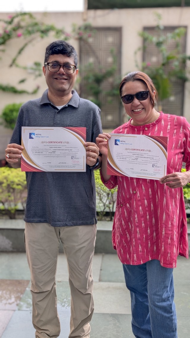 Chirag Trivedi (left) and his wife Ashaka (right) receive certificates of completion upon the conclusion of their trip to Everest Base Camp in May 2025.