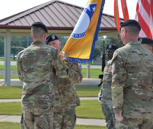 U.S. Army Photo: Brig. Gen. Allen Pepper, U.S. Army Security Assistance Command commanding general, passes the command’s colors from Command Sgt. Maj. Stephen Burnley to Command Sgt. Maj. Michael Cordery during USASAC’s change of...