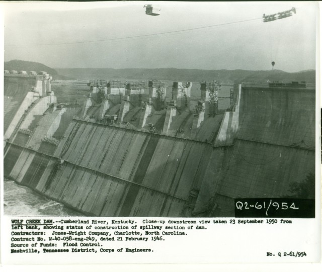 This is Wolf Creek Dam under construction Sept. 23, 1950, on the Cumberland River in Jamestown, Kentucky. The multi-purpose dam would serve to replace the old locks and dams on the Cumberland River. (USACE Photo)