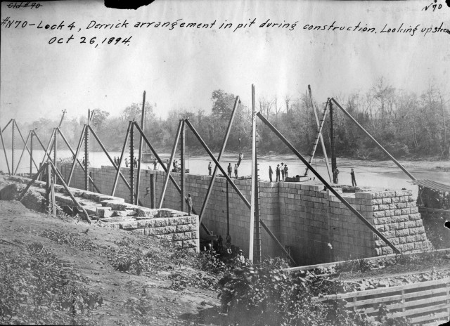 A Derrick arrangement is in the pit during the construction of Lock 4 Oct. 26, 1894 on the Cumberland River in Tennessee.  The lock and dam were constructed to establish a navigation channel. The lock and dam were replaced by today's modern system...