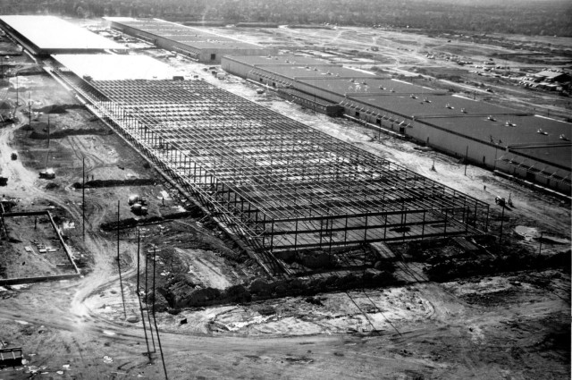 a black and white aerial photo of a large construction site