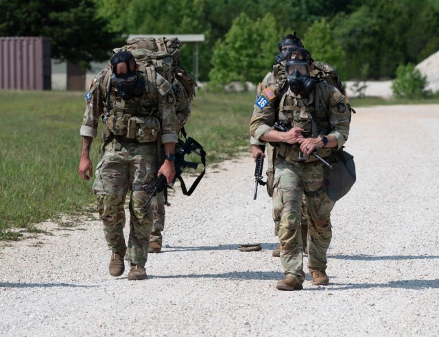 Competitors of the 2025 Sgt. 1st Class Jeremiah W. Johnson Best Chemical, Biological, Radiological and Nuclear Warrior Competition participate in a 7.4-mile foot march June 1 across Fort Leonard Wood.