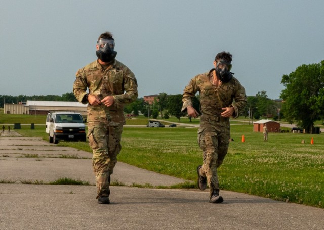 Staff Sgts. Joseph Stone and Joseph Carri, with the Defense Threat Reduction Agency, run in the final event of the 2025 Sgt. 1st Class Jeremiah W. Johnson Best Chemical, Biological, Radiological and Nuclear Warrior Competition June 2 on Gammon Field.