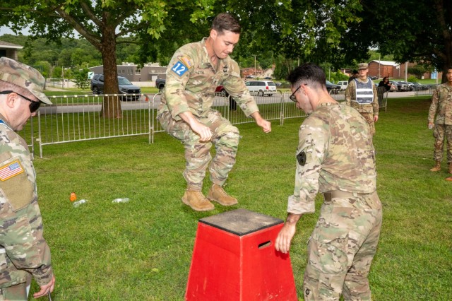 Sgt. 1st Class Jeremiah W. Johnson Best Chemical, Biological, Radiological and Nuclear Warrior Competition winners, Staff Sgts. Joseph Stone and Joseph Carri, with the Defense Threat Reduction Agency, participate in the nonstandard physical...