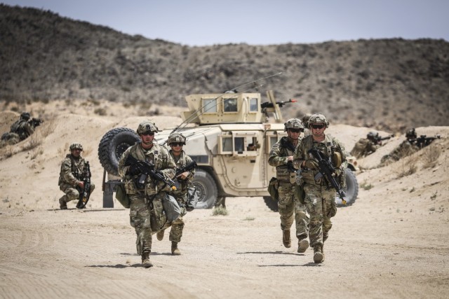 Army Reserve Soldiers secure the perimeter of their forward operating base during exercise Mojave Falcon at the National Training Center, Fort Irwin, Calif., June 1, 2025. Mojave Falcon 2025 is a multi-faceted first-of-its-kind Army Reserve training exercise that integrates Combat Support Training Exercise (CSTX), Global Medic, Quartermaster Liquid Logistics Exercise (QLLEX), Port Operations and Nationwide Move.
