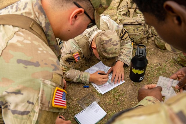 Staff Sgt. Thomas Newsome, an infantryman assigned to 1st Battalion, 8th Cavalry Regiment, 2nd Armored Brigade Combat Team, 1st Cavalry Division, measures point coordinates during the land navigation section of a best squad competiiton on Fort...