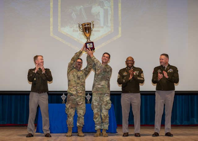 The winners of the 2025 Sgt. 1st Class Jeremiah W. Johnson Best Chemical, Biological, Radiological and Nuclear Warrior Competition, Staff Sgts. Joseph Carri and Joseph Stone with the Defense Threat Reduction Agency, celebrate their win during an...