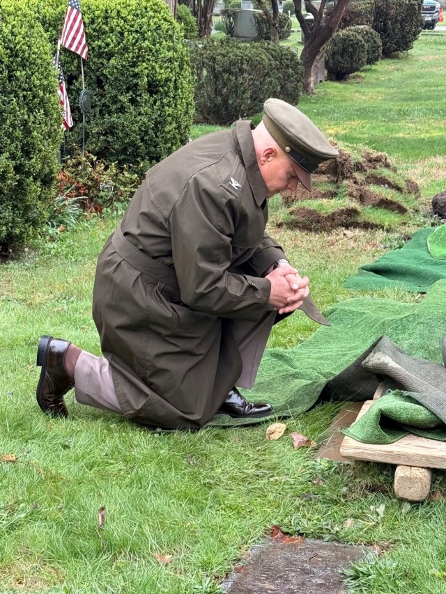 Col. Michael Solovey, assistant chief of staff, G4, U.S. Army Intelligence and Security Command, visiting the footstone of his grandfather who also served in the U.S. Army.