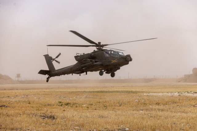 A U.S. Army AH-64 Apache helicopter, assigned to Task Force Nighthawk, lands at Rumalyn Landing Zone in northeastern Syria on May 4, 2025. U.S. Army attack helicopter designed primarily for close air support, anti-armor operations, and armed...