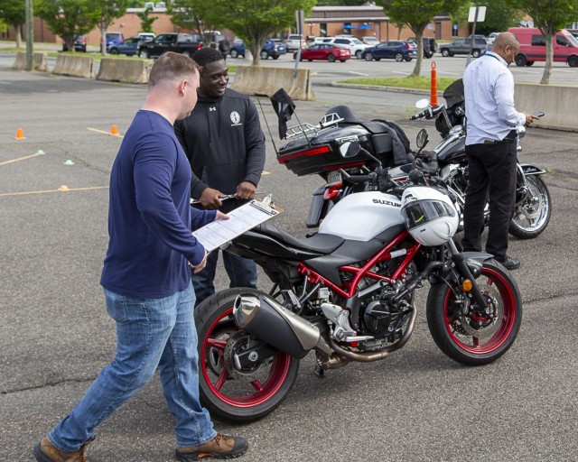 A motorcycle instructor performs safety checks on a bike during the Fort Belvoir Safety, Health, Wellness and Resiliency Expo, May 15. The morning-long event highlighted the 101 Critical Days of Summer and offered ways to mitigate many of the...