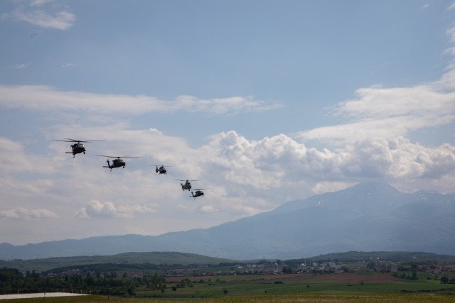 U.S., Hungarian and Swiss aviation forces assigned to the NATO-led Kosovo Force mission, also known as KFOR, conduct an international partner multi-ship familiarization flight, or IPMFF, around Camp Bondsteel, Kosovo, May 12, 2025. The U.S. troops...