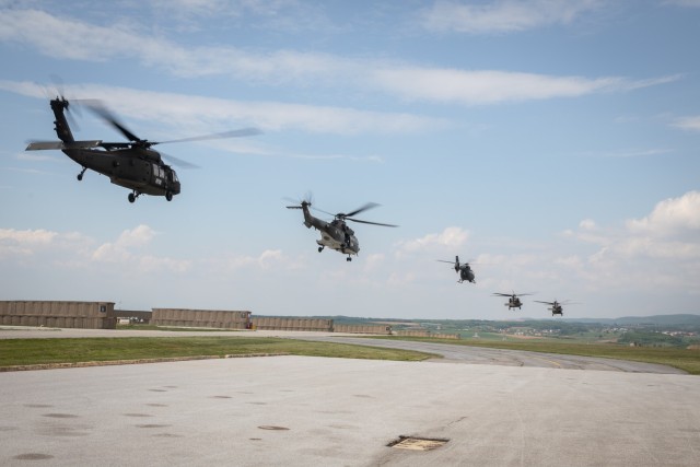 U.S., Hungarian and Swiss aviation forces assigned to the NATO-led Kosovo Force mission, also known as KFOR, conduct an international partner multi-ship familiarization flight, or IPMFF, around Camp Bondsteel, Kosovo, May 12, 2025. The U.S. troops...