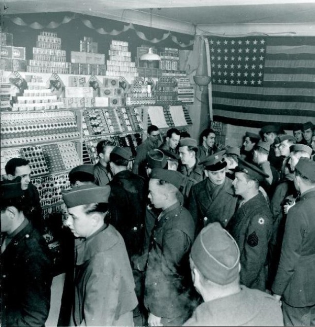 American Soldiers line up at the counter of the exchange on Audley Street in London during World War II, 1944.