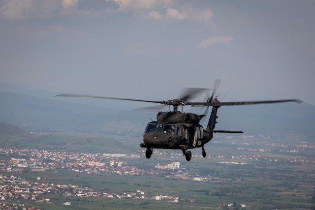 U.S., Hungarian and Swiss aviation forces assigned to the NATO-led Kosovo Force mission, also known as KFOR, conduct an international partner multi-ship familiarization flight, or IPMFF, around Camp Bondsteel, Kosovo, May 12, 2025. The U.S. troops...