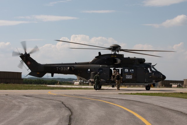 U.S., Hungarian and Swiss aviation forces assigned to the NATO-led Kosovo Force mission, also known as KFOR, conduct an international partner multi-ship familiarization flight, or IPMFF, around Camp Bondsteel, Kosovo, May 12, 2025. The U.S. troops...