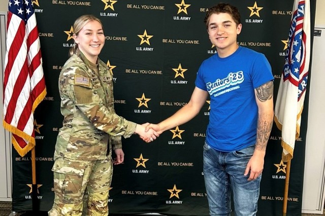 Chase Cribbett, right, shakes hands with his Army recruiter after enlisting in the service.