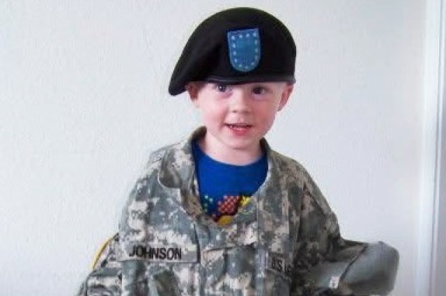 A baby photo of Christopher Johnson II shows him wearing the uniform of his father, Army Staff Sgt. Christopher Johnson I.