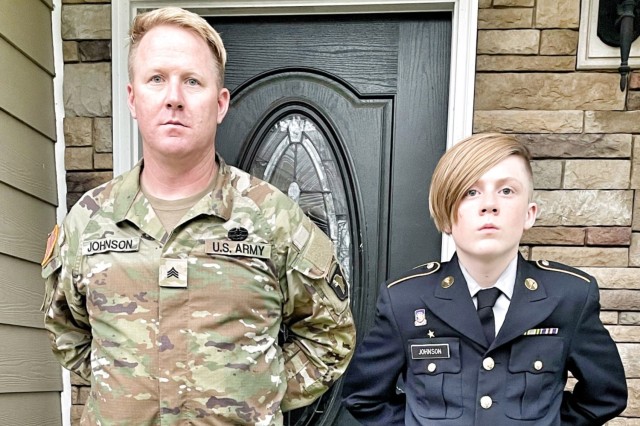 Army Staff Sgt. Christopher Johnson I and his son, Christopher Johnson II, stand at ease outside their home. Johnson II, who took part in Junior ROTC at Fort Campbell High School, Kentucky, just graduated and plans to enter the Army in the fall.