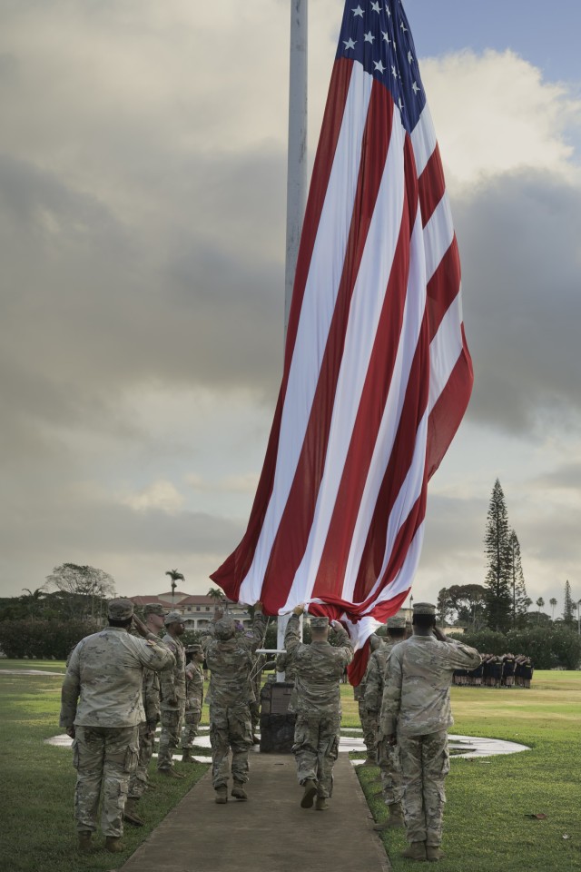 Schofield Barracks, Hawaii – The American flag is raised during reveille June 9, 2025, at Weyand Field, signaling the start of Army Heritage Week. The flag raising, also known to troops as reveille, symbolizes not only the start of the day with...