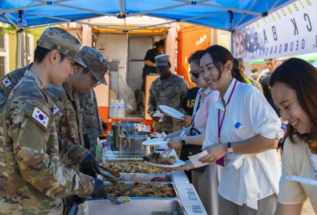 U.S. Army and Korean Augmentation to The United States Army (KATUSA) soldiers, and family members, taste test Korean cuisine during a K-Culture Festival as a part of U.S.-Soldier-KATUSA Friendship Week at Camp Humphreys, South Korea, June 10,...