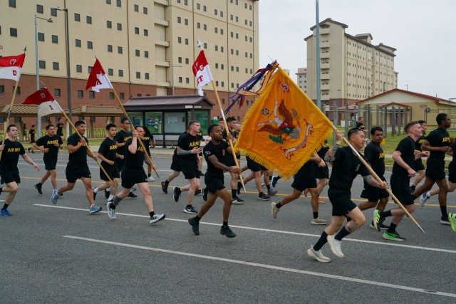 U.S. Army soldiers participating in the Eighth Army Garrison run carry their unit guide-ons to celebrate KATUSA Friendship Week 2025 at Camp Humphreys, South Korea, June 9, 2025. The run signals the start of KATUSA Friendship Week, a celebration...